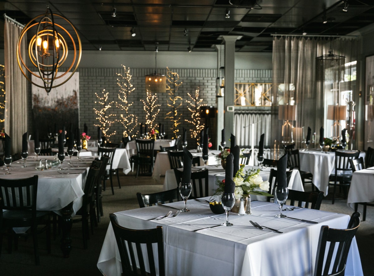 Interior of Evangeline's white table cloth establishment in Tuscaloosa, Alabama.