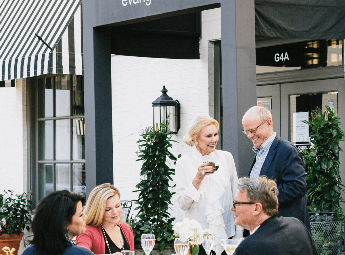 Evangeline's Customers enjoying entrees and cocktails.